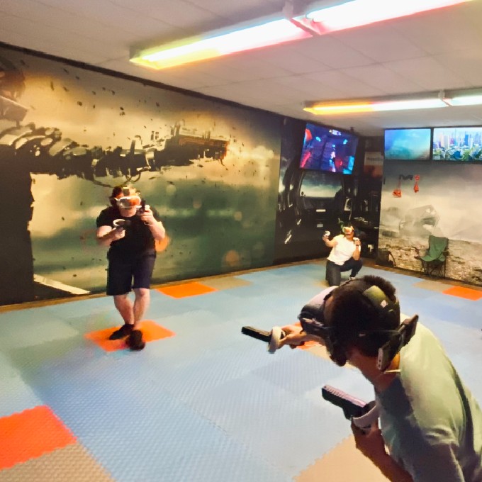Two People Battling in VR Room