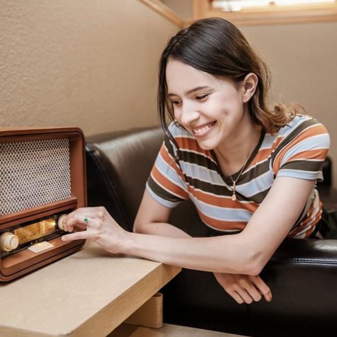 Girl Touching Old Radio