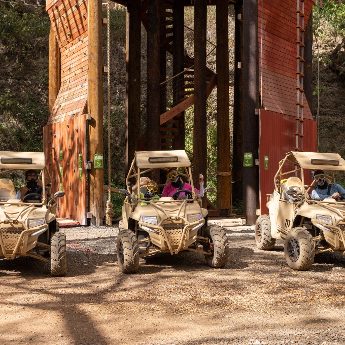 Three ATV's in Front of Obstacle Course