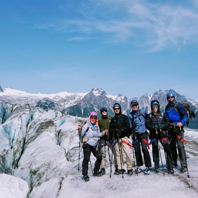 Group Posing on Snowy Mountain 