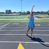 Girl Posing on Breakfast Club Field