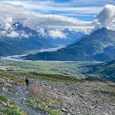 Person Walking on Path with Mountain View