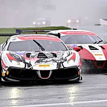 Two Ferrari's Racing on Track