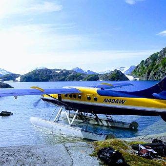 Seaplane on Water with Surrounding Mountains