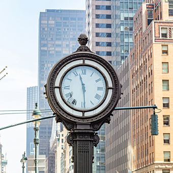 Clock with City in Background