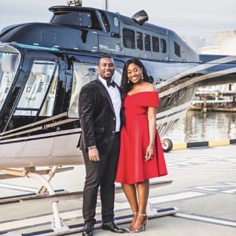 Couple in Front of Helicopter