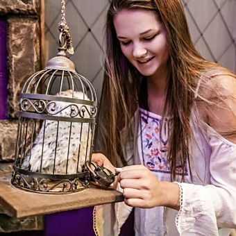 Girl Holding Bird Cage