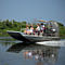 Group on Airboat Gliding Across Water
