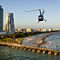 Helicopter Close to Beach with City Background