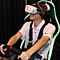 Guy in Chair with VR Goggles Driving