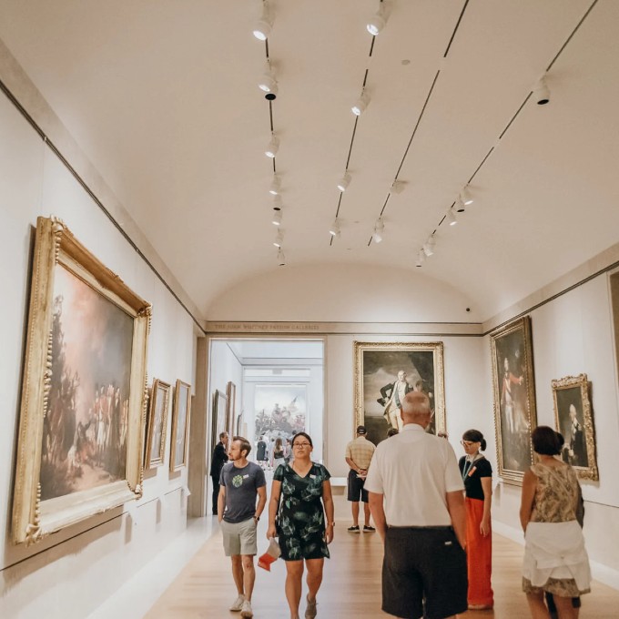 Group Walking Through Art Exhibit