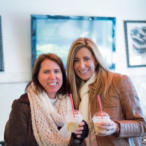 Two Women with milkshakes on a food tour in Pittsburgh