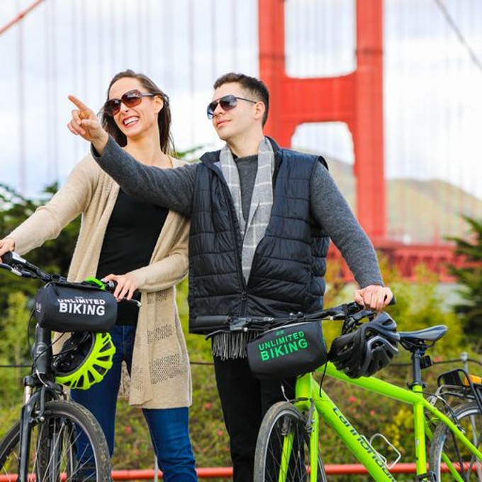 Couple in Front of Golden Gate Bridge on Bikes